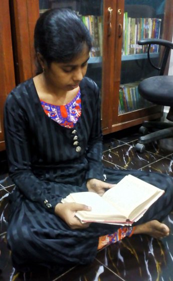 Zardab Shah reading a book at the library