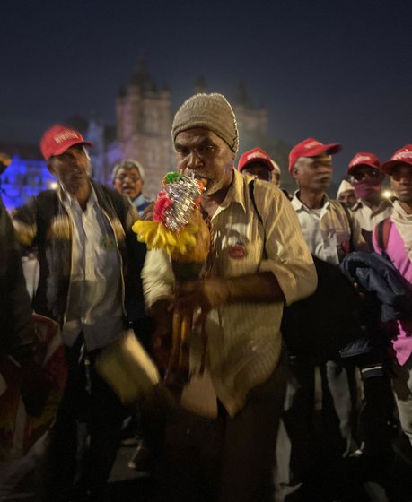 Arriving at night at Azad Maidan in Mumbai, the tired farmers celebrated with the tarpa, a musical instrument (left)