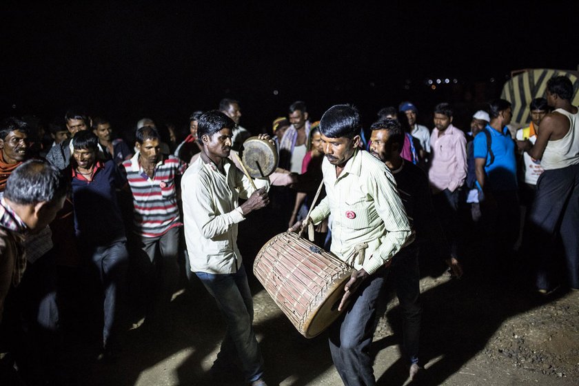 Farmers dancing the Toor dance and playing the drum