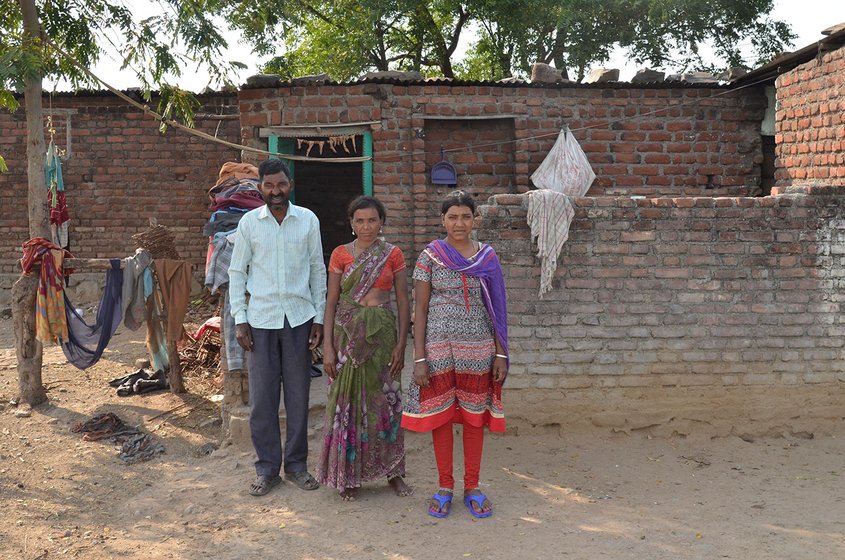 Surnita Pawar with husband and elder daughter outside their house