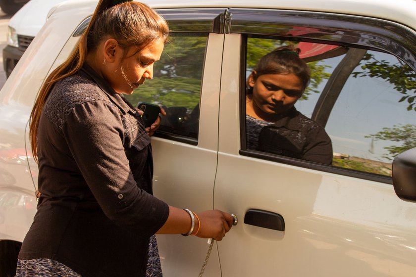 Shabnambanu Shehadali Sheikh works for a app-based cab company in Ahmedabad. A single parent, she is happy her earnings are putting her daughter through school
