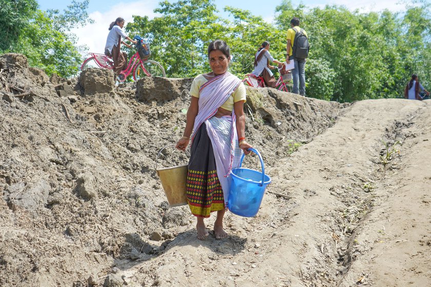 Left: Madhabi Das descends from the embankment to fetch water from a sand filter at her house. Since June 2023, she has had to make this journey to get drinking water.