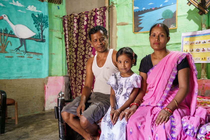 Left: Dutta with his wife Neeta and their daughter Anushka at home in Garamur, Majuli.
