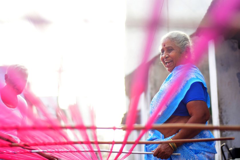 Manonmani Punnakodi and her family members prepare the warp early in the morning. The loom is washed with rice water. The starchy water helps separate the threads quickly and crisply. They are separated to a particular count for the loom
