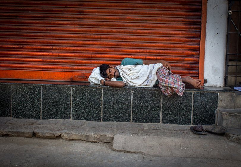 A labourer, who has found no work for the day, goes to sleep around 10 a.m