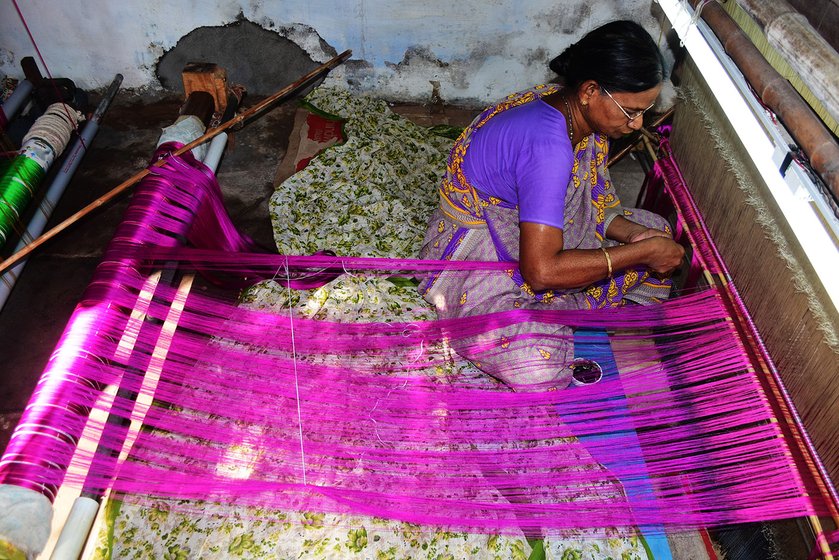Saraswathi Eswarayan fixes the warp to the loom, traditionally called ‘paavu punaithal’. This task is usually done by women, who twist 4,500-4,800 strands by hand on the loom. 