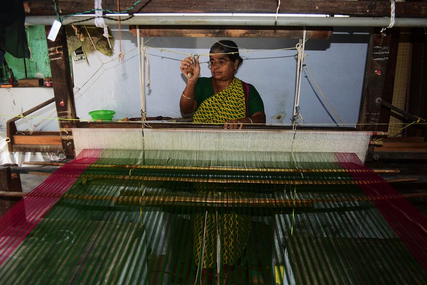 Jayakantha Veerabathiran,  45, weaves a plain saree that will later be embellished with  embroidery. In most homes, the looms are placed on the floor with a  shallow pit  for the pedals 