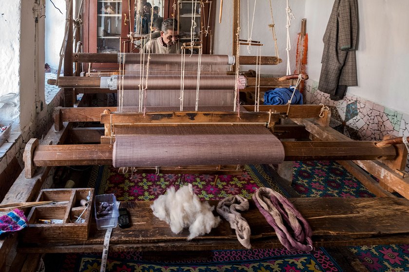 Mohammed Sidiq Kotha and his son Irshad Ahmed Kotha have been hand-weaving pashmina shawls on the charka for decades. They that the speed of machine-woven shawls is hard to compete with 