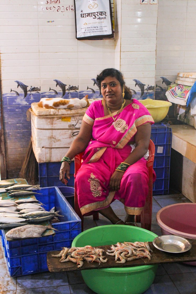 Left: Manisha Jadhav, head of the local fisherwomen’s association, Sindhusagar Macchi Vikri Mahila Sanghatna, Malwan, exudes confidence as she sits with her fish in the market. Right: Women of the community

