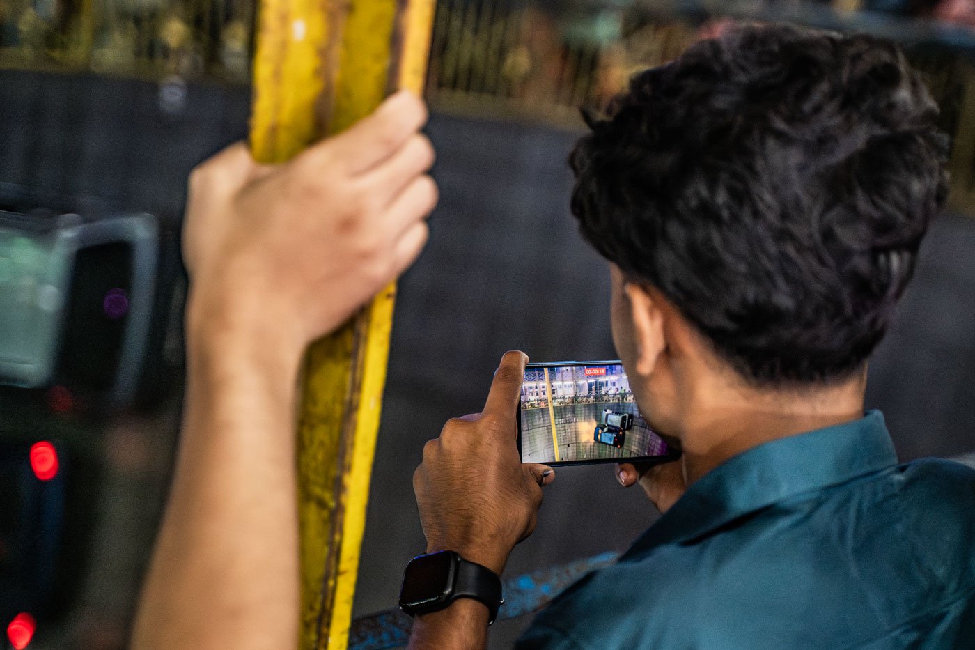 A spectator takes a video of the act. Consistent favourites, this show became so popular at this mela that they extended their performances from five days to an additional two