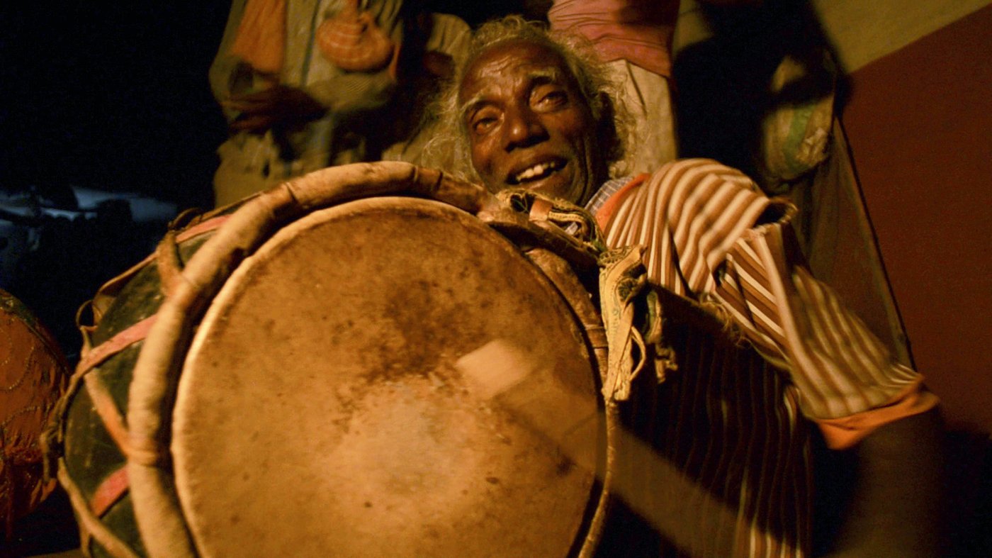 Man playing traditional instruments