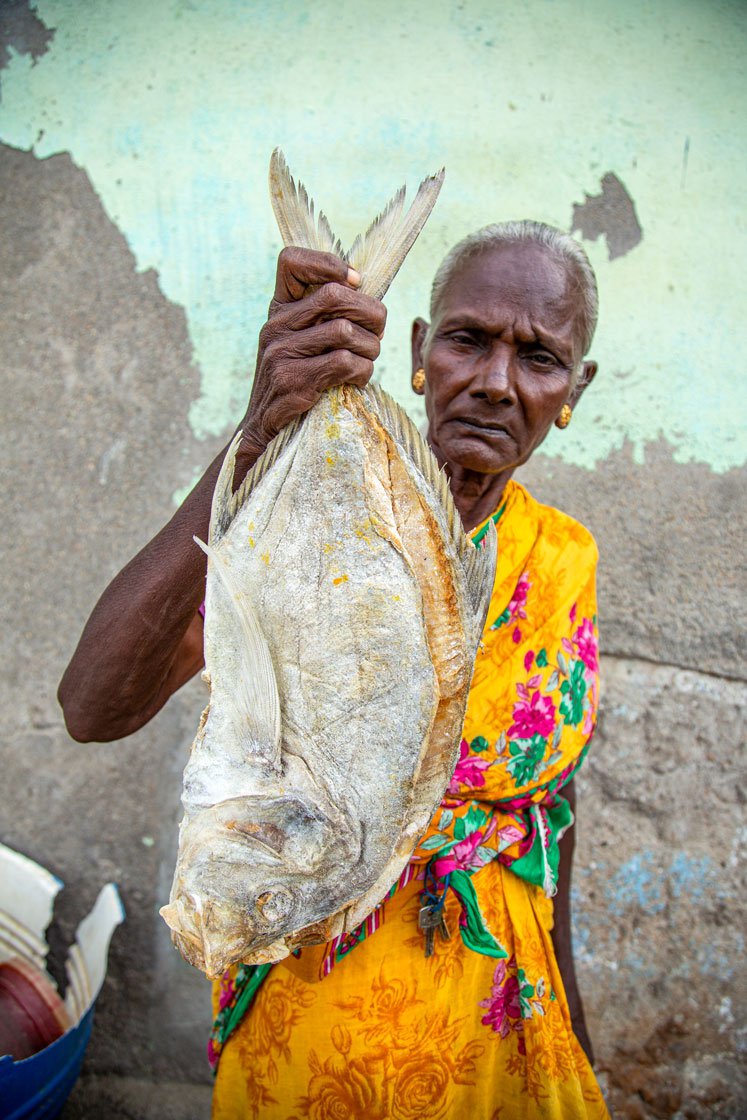 Right: Fathima with a Paarai meen katuvadu (dried Trevally fish)