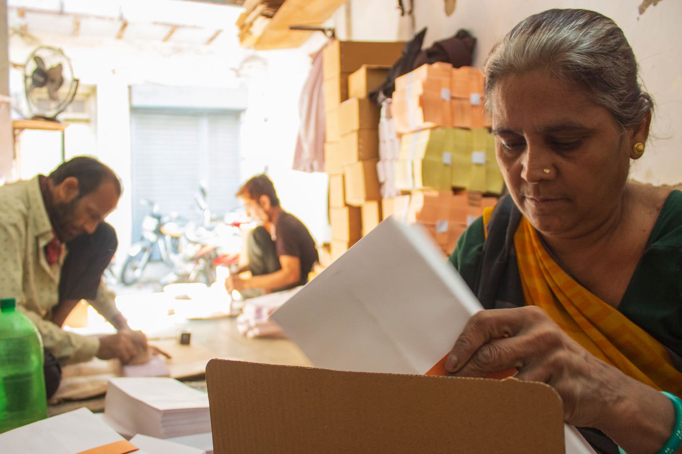 Shardaben Rawal placing the envelopes in a box. Other than her, there is not a single woman working in any of the 35 envelope workshops in Ahmedabad
