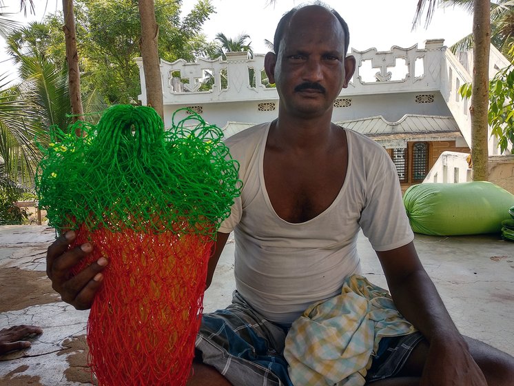 Man working on fish net