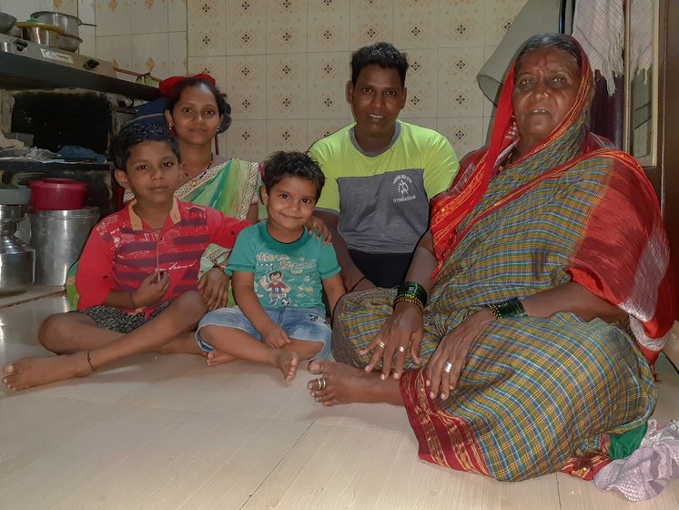 Balappa Chandar Dhotre's family members sitting together in their house