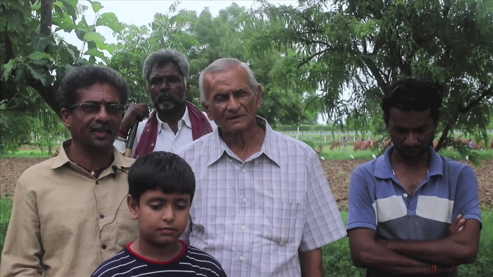 Hiteshkumar Patel (far left) of Davda village with other villagers