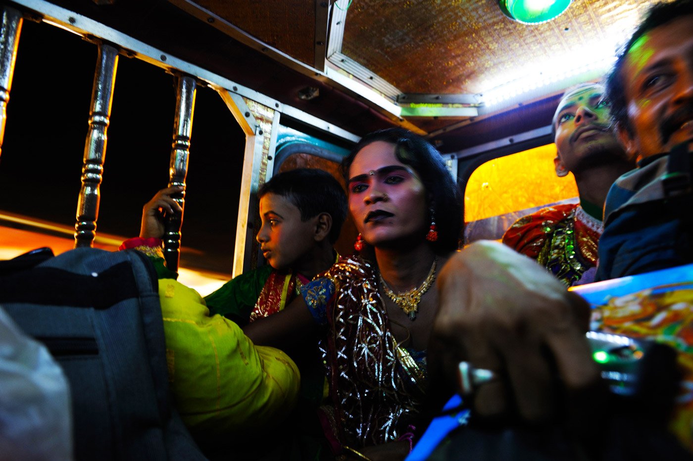 Actors sitting in autorickshaws.