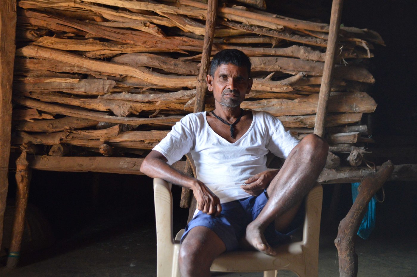 Left: Bhagat Kalu Jangali at his home in Pangri village in Mokhada taluka. Right: Bhagat Subhash Katkari with several of his clients on a Sunday at his home in Deharje village of Vikramgad taluka in Palghar district