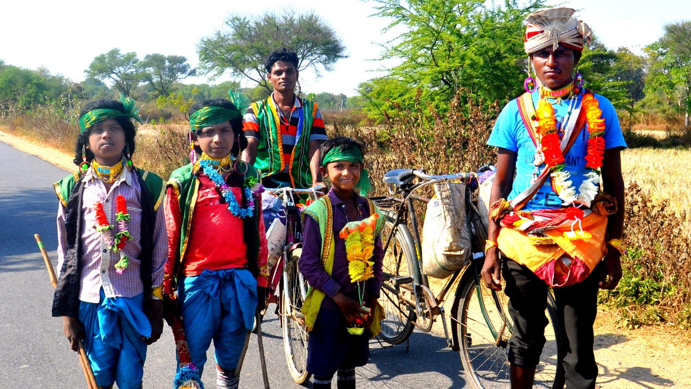People dressed in colourful costumes on highway