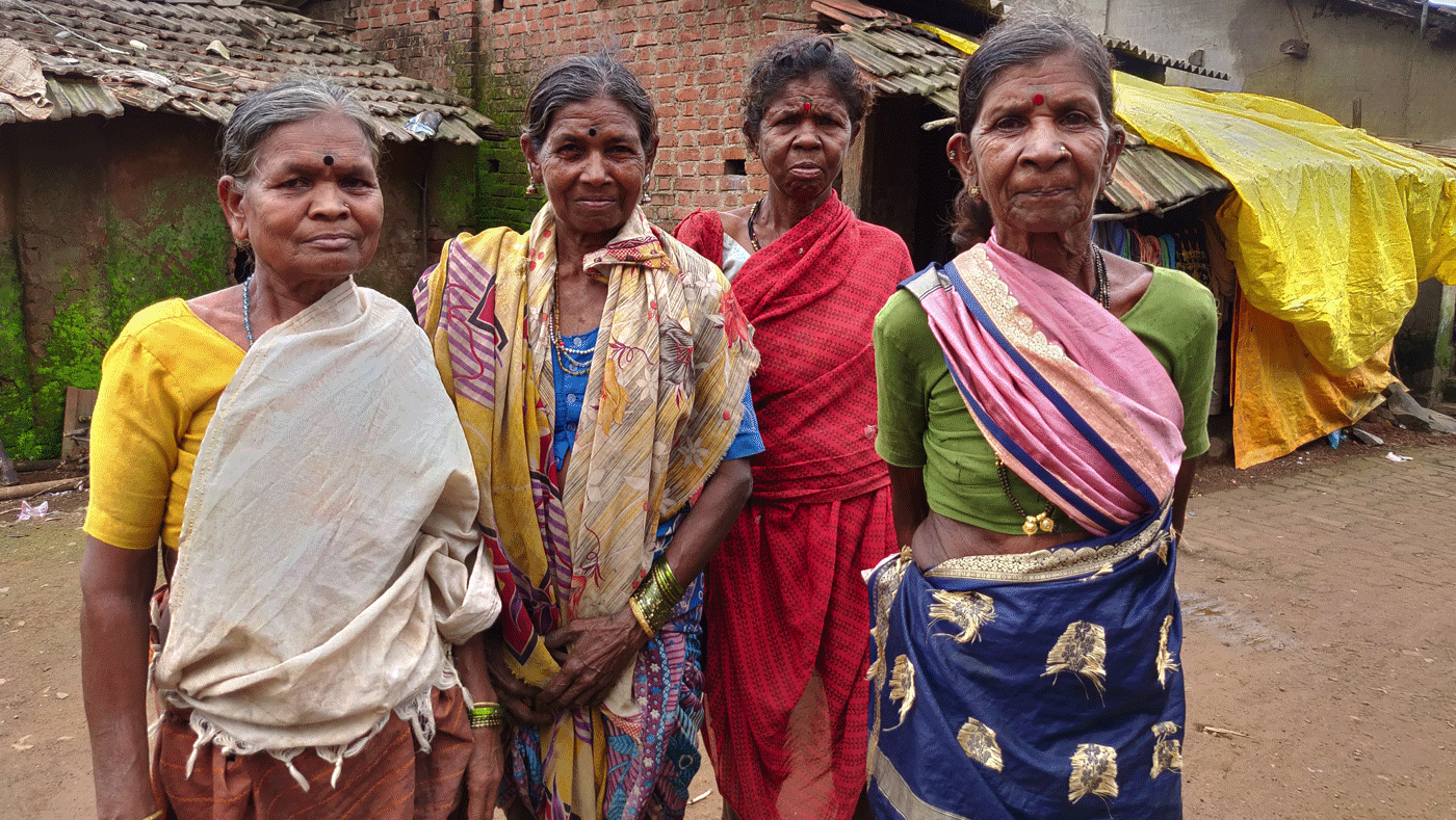 Four old women standing in village