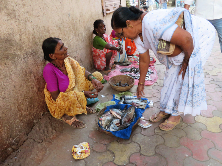 Old lady selling fishes 