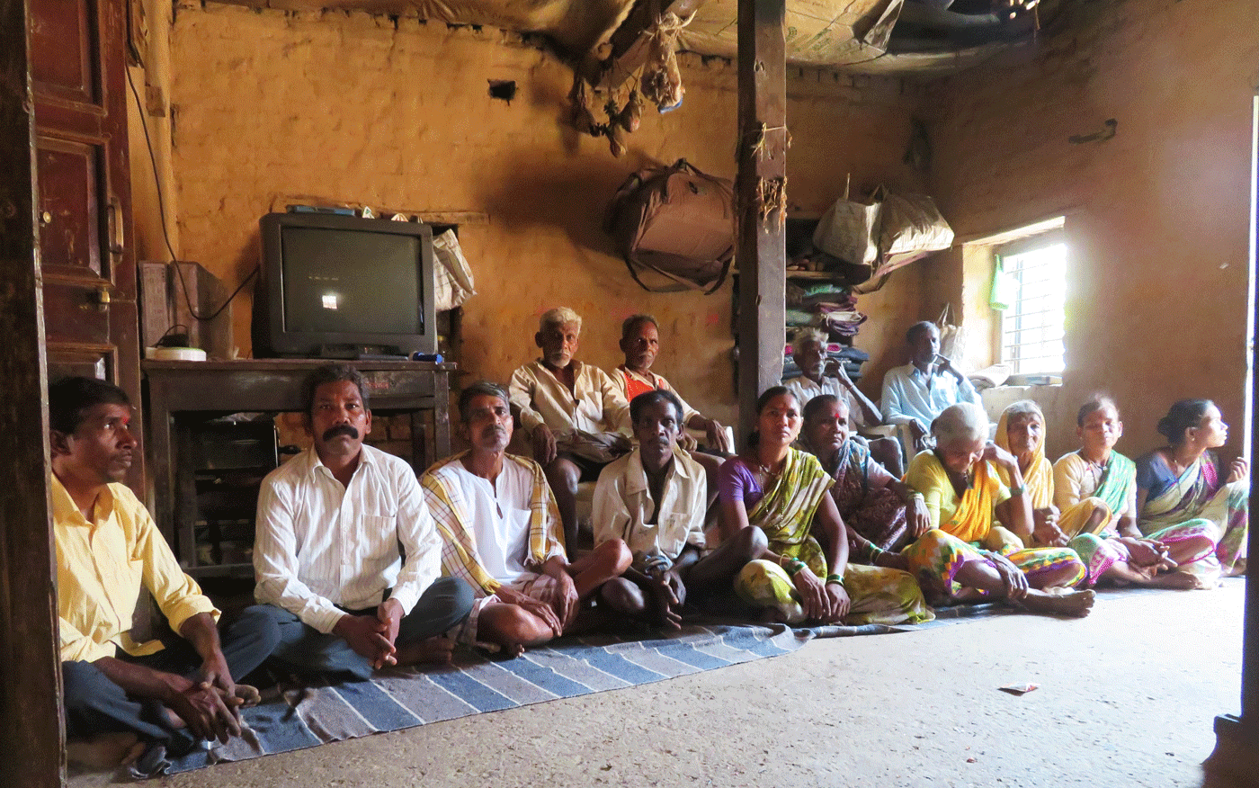 Group of villagers discuss upcoming elections