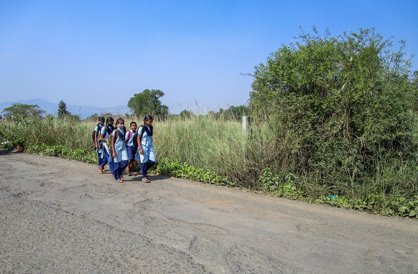 School children near Satesai walking to school to Paud, 10 kilometres away.