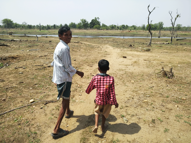 Beersingh's father-in-law Babulal Atram and elder son Vivek in Pindkapar village, which is located along the backwaters of Nagpur district's Bawanthadi dam, around which are the forests adjoining the Pench tiger reserve