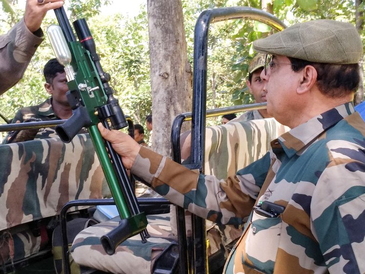 Shafath Ali (left, with the green dart gun) and his team leaving in their patrolling jeep from the base camp in Loni to look for T1, a hunt that finally ended on November 2, after two months of daily tracking, and two years of the tigress remaining elusive