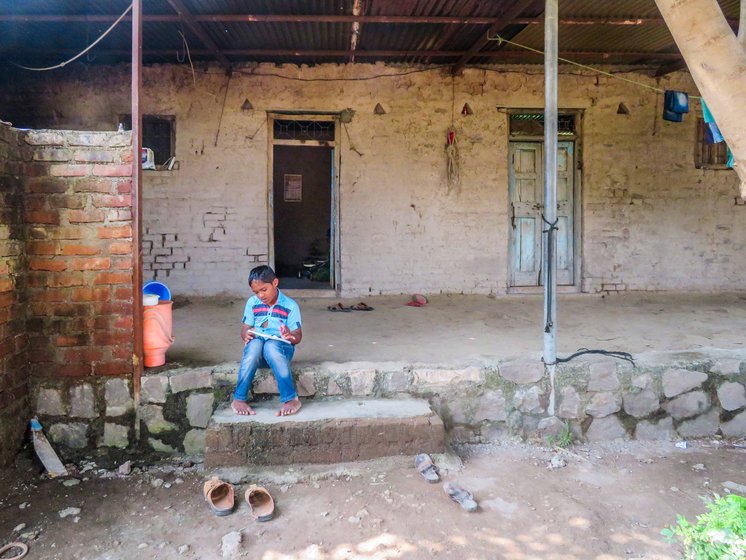 With school shut, Prateek spends his days sitting at the threshold of his one-room mud house, watching a world restricted now to the front yard
