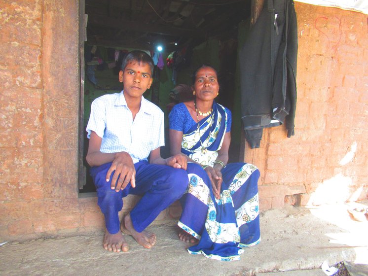 Mangala Burange with her son Sagar seated outside their house