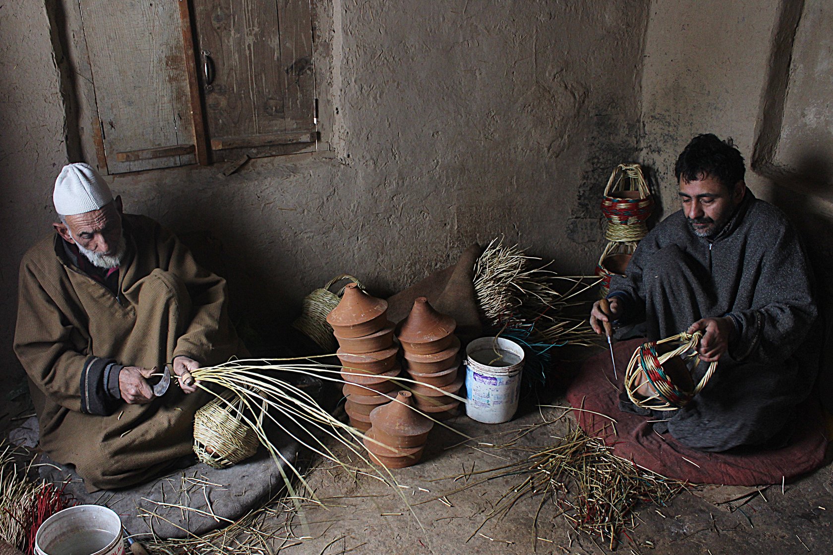  Khazir Mohammad Malik, along with Manzoor Ahmad, weaving kangris at his workshop in Charar-i-Sharief