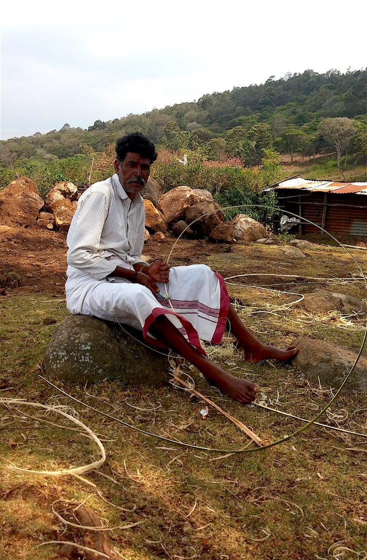 Kathi Kuttan making bamboo strips for a new temple in his Toda village