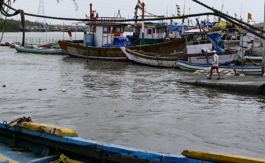 Left: Struggling against a changing tide – fishermen at work at the koliwada. Right: With the fish all but gone from Malad creek and the nearby shorelines, the fishermen of Versova Koliwada have been forced to go deeper into the sea