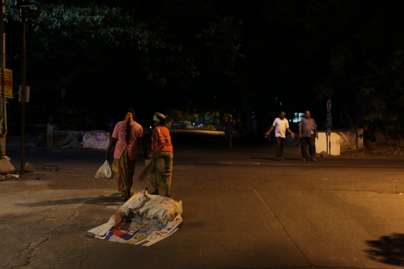 With just a few passers-by on the road at this late hour, they continue to quietly work to keep White Town clean