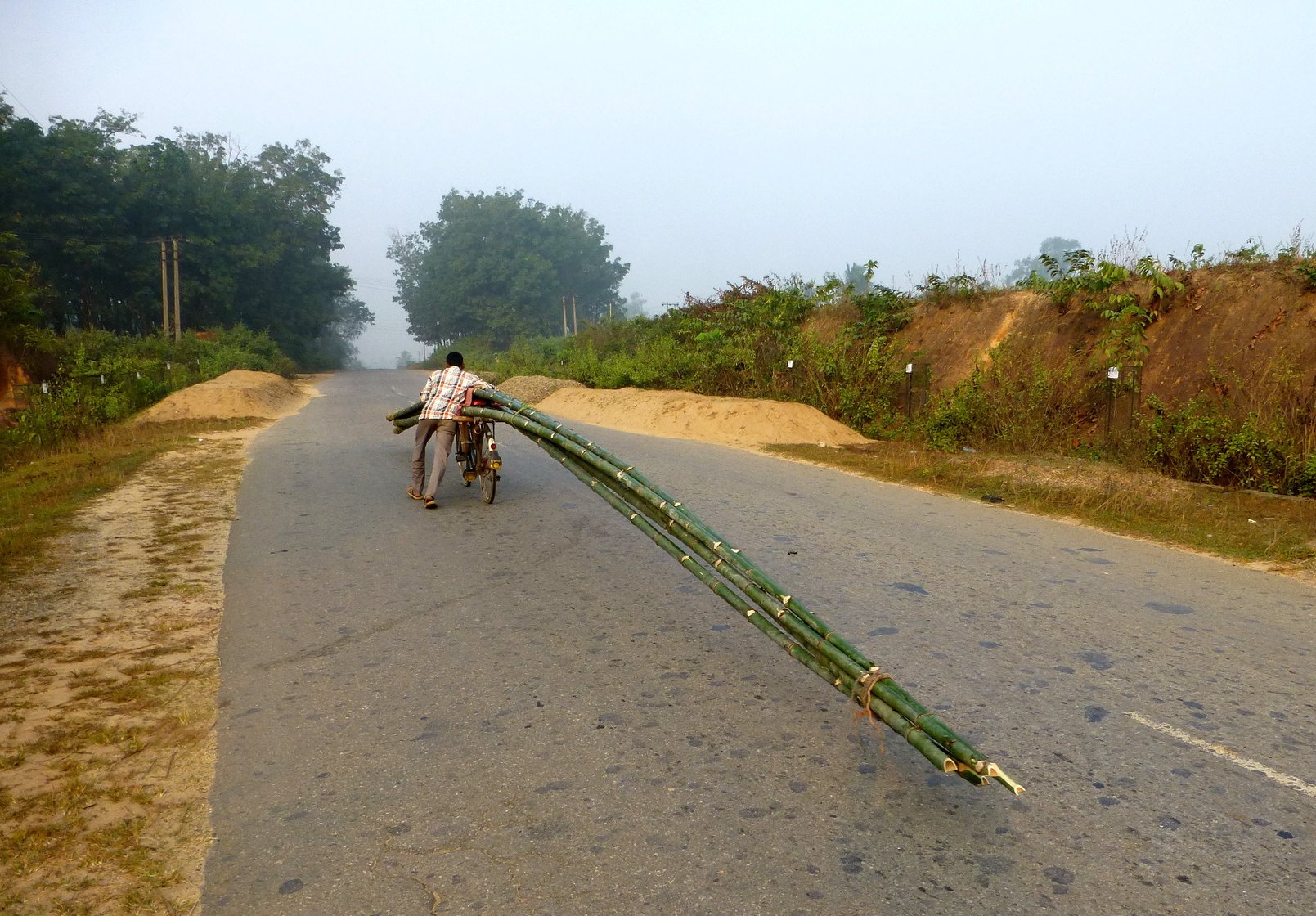 Biswas pushes off in the opposite direction, his bicycle's 40-feet tail wagging gently behind him