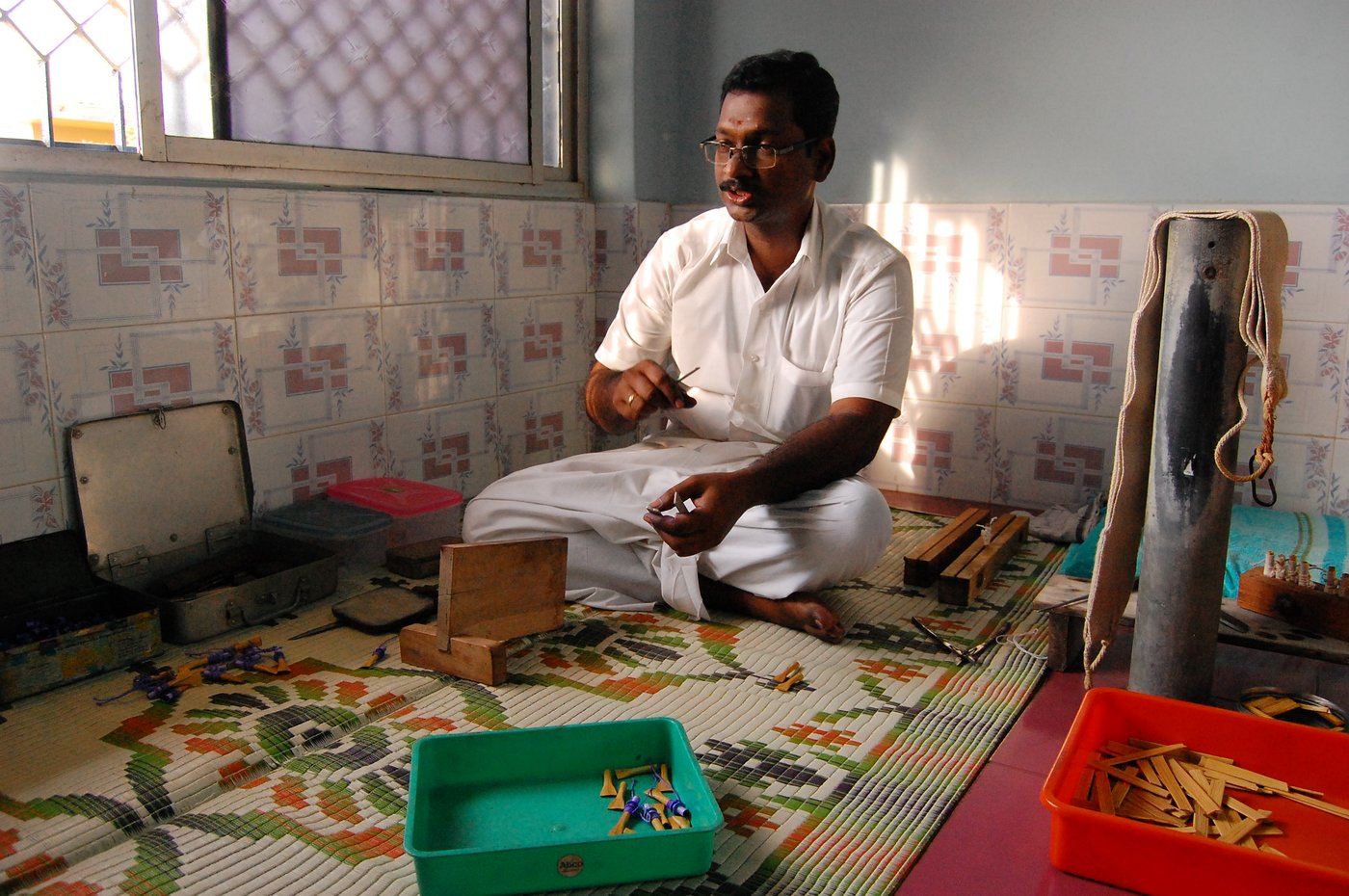 Man making Seevali, a handmade reed mouth-piece to play the Nadaswaram