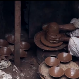 Muslim Man making clay pots