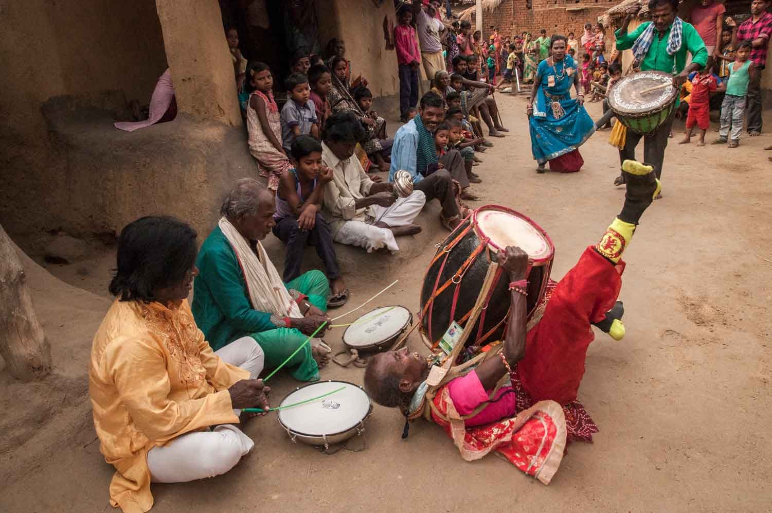 An artist is playing drum