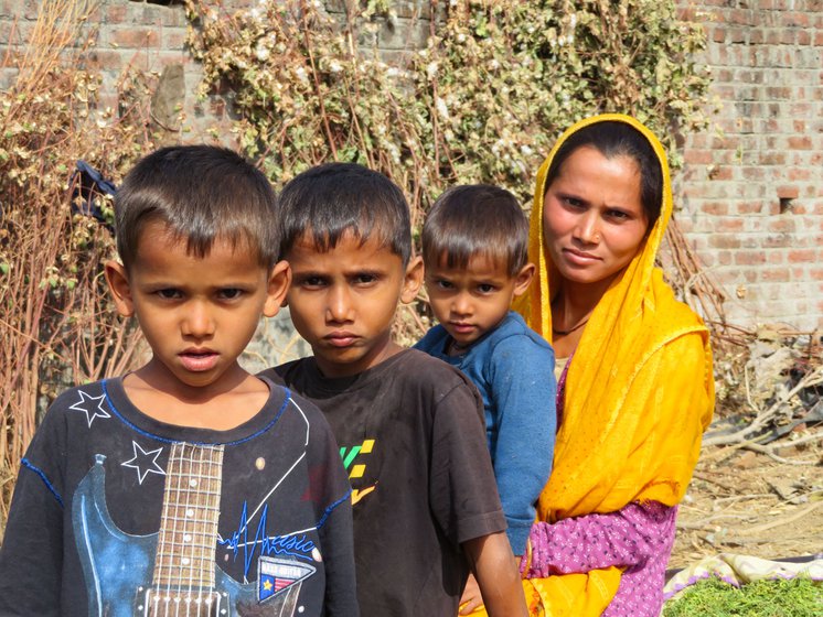 Sangeeta in Churada village of Kushalgarh block with her three children. She arrived at her parent's home after her husband abandoned her and she could not feed her children