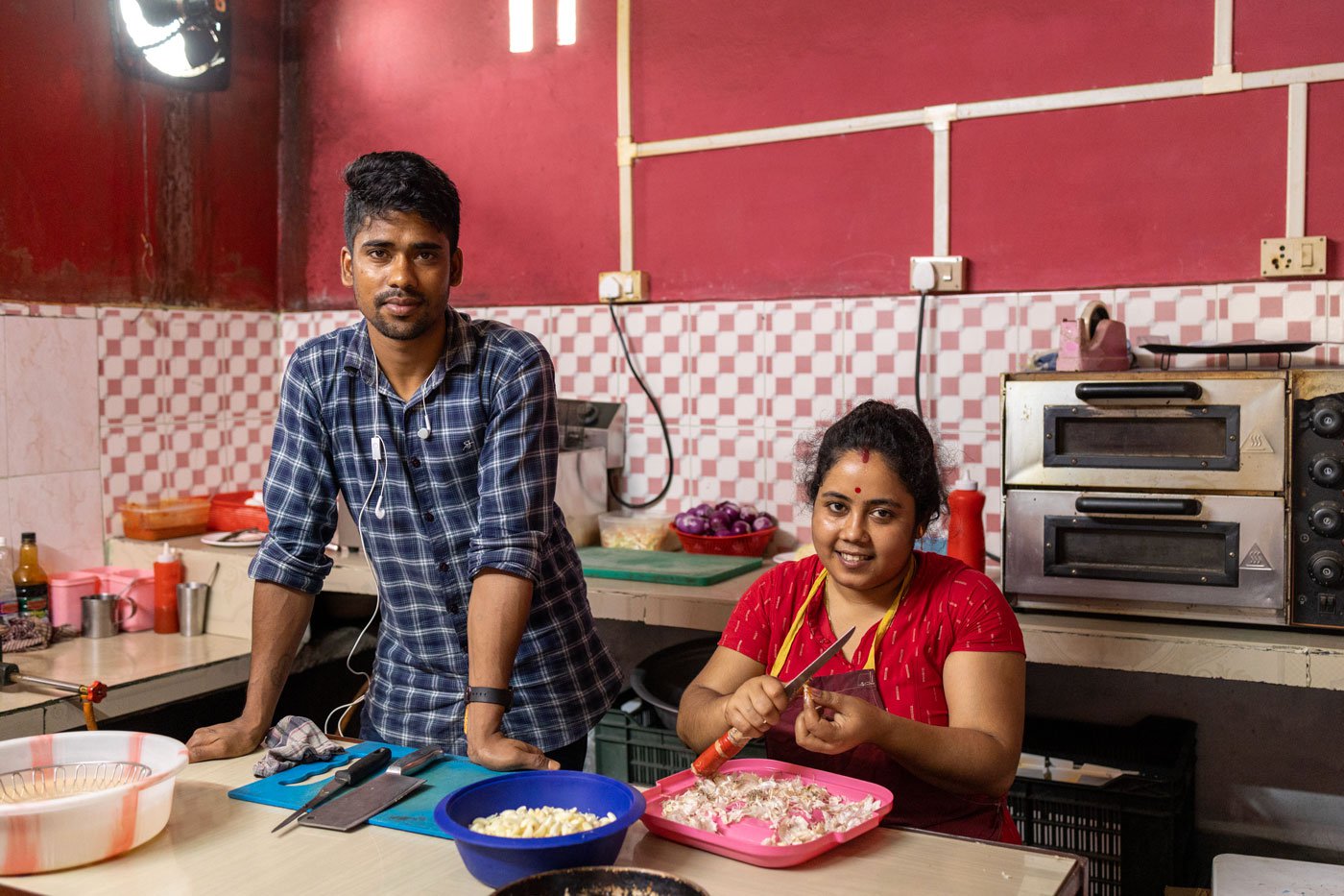 Biman Das (left) and Debajani (right), his wife and business partner at KFC, their restaurant in Natun Kulamora Chapori