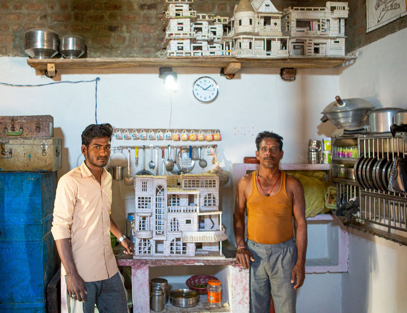 Jaypal with one of his paper creations; he also designs doors made by father Dilawar Chouhan (right), who works as a carpenter