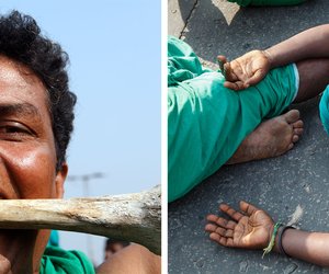 Left: A farmer from Tamil Nadu clenches a bone between his teeth as a sign of protest.

Right: A farmer from Tamil Nadu lies down on the road to rest before continuing on to Parliament Street.

