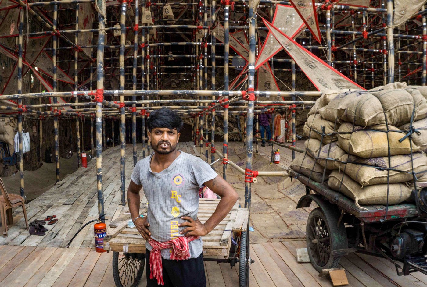 This worker in Behala said he identified with the Durga-as-migrant theme, finding it to be about people like himself