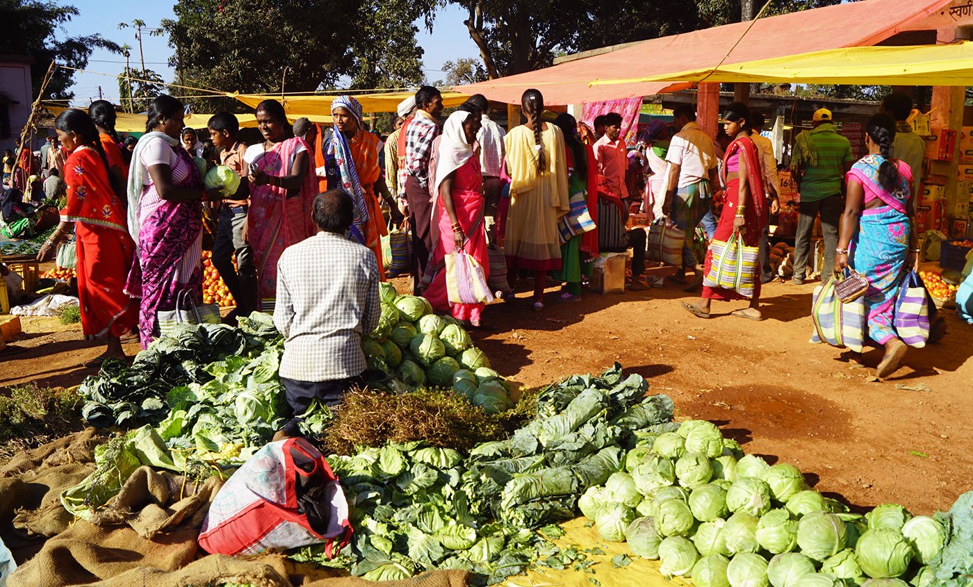 A man selling vegetables at Amabeda haat