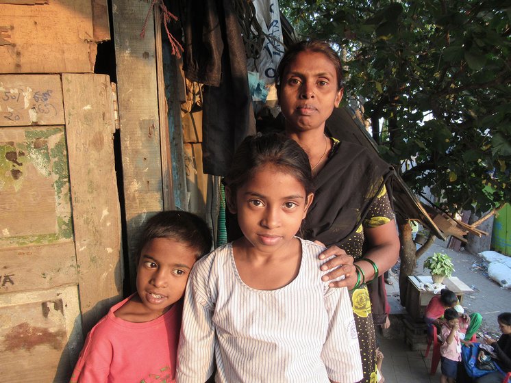 A woman and her son and daughter