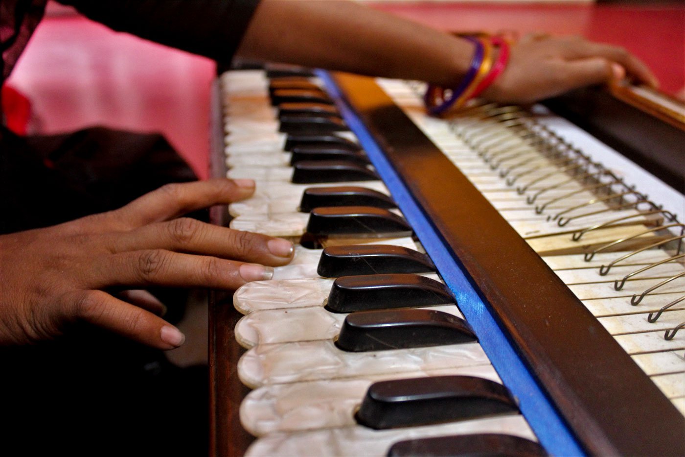 All the sex workers in the brothel are required to know and perform mujra; Beauty is also learning to play the harmonium