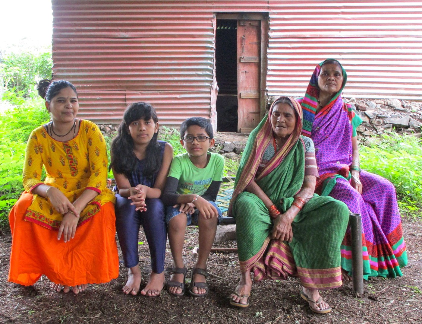 Gunamay Kamble (in green saree) with her family in Wagdari village of Tuljapur taluka . From the left: granddaughter Shridevi (in yellow kurta); Shridevi's children; and Gunamay's daughter Vandana (in purple saree)