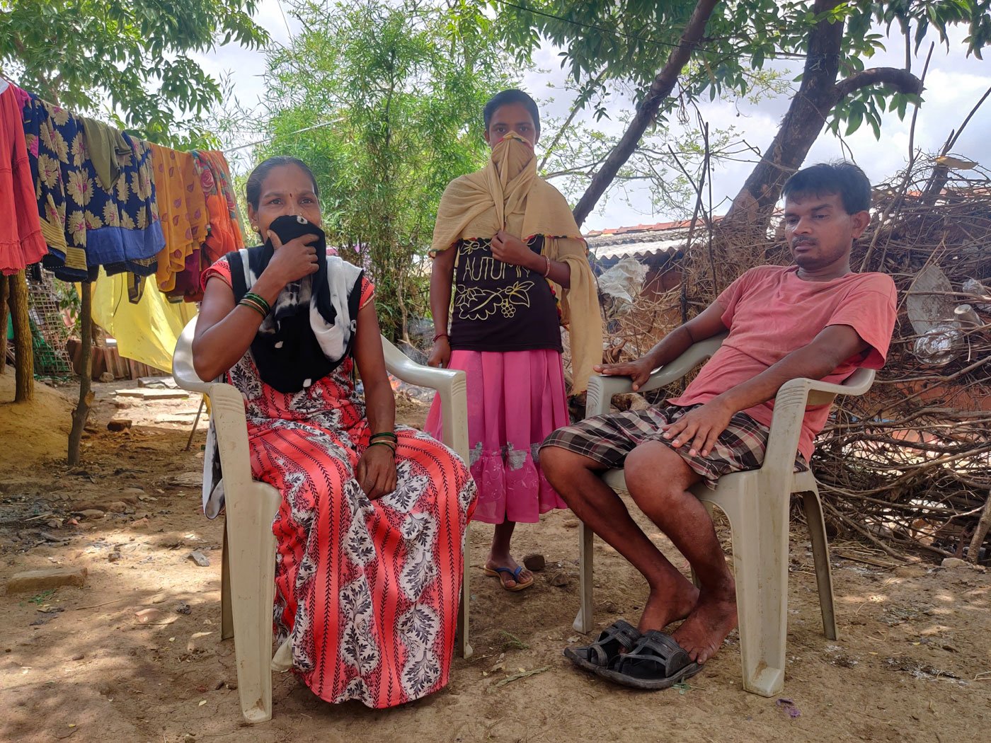 Rajesh Andhare, a labourer, spent a month's earnings to buy a smartphone for his son Dinesh. Here, with his wife Chandan and their daughter Anita, who is doubtful about learning through a phone