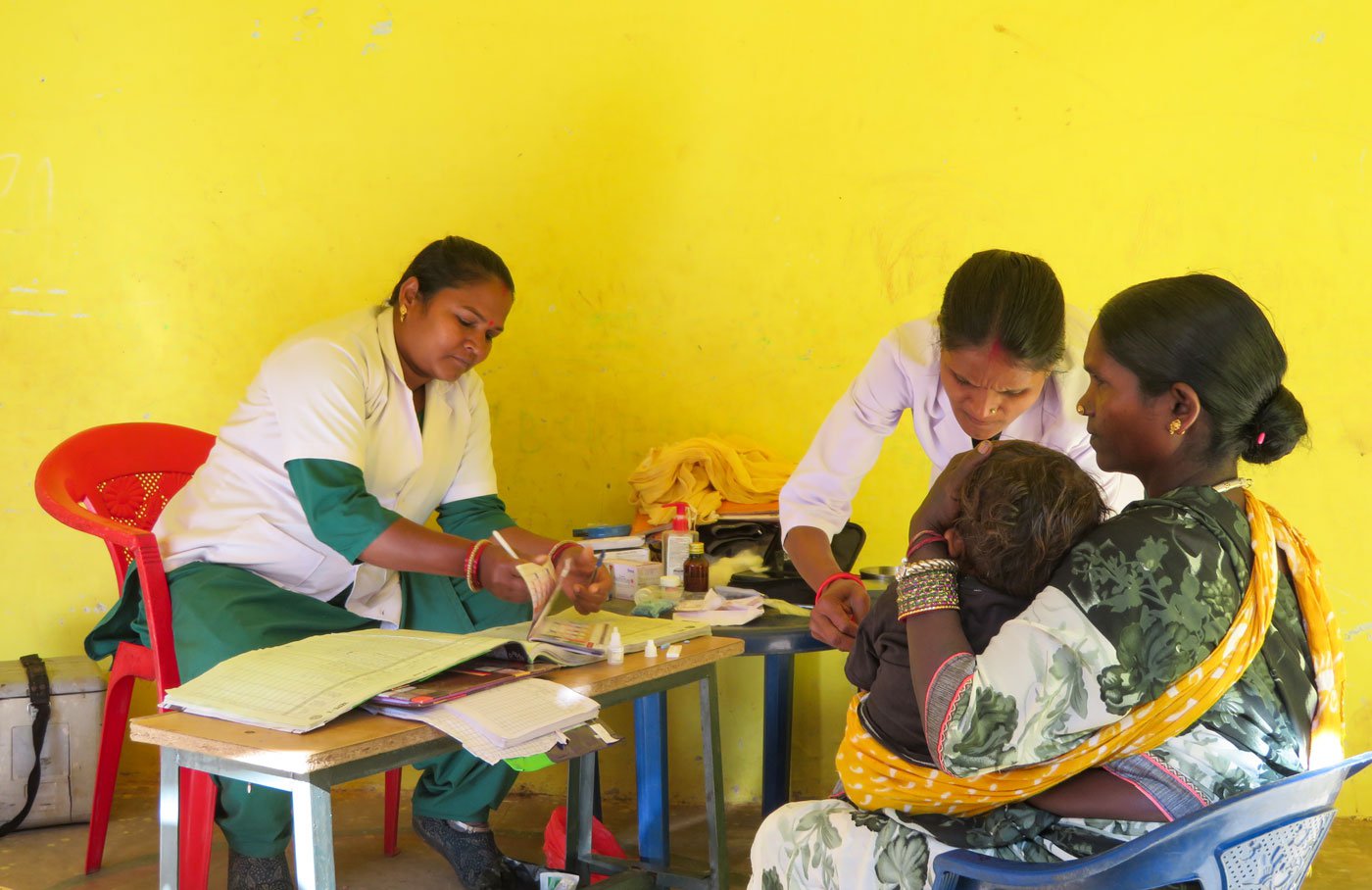 At a makeshift clinic in an anganwadi, Urmila Dugga notes down the details of a malaria case, after one of the roughly 400 malaria tests that she and her colleagues conduct in a year in six villages in Narayanpur block